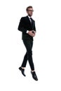 Elegant young man in black suit joining hands and smiling Royalty Free Stock Photo