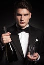 Elegant young man holding two glasses Royalty Free Stock Photo