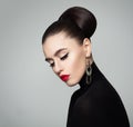 Elegant Young Woman with Hair Bun Hairstyle Royalty Free Stock Photo