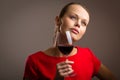 Elegant young woman having a glass of red wine Royalty Free Stock Photo