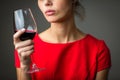 Elegant young woman having a glass of red wine Royalty Free Stock Photo