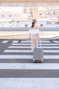 Elegant young woman with luggage at a train station. tourism concept Royalty Free Stock Photo