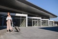 Elegant young woman with luggage at a train station. tourism concept Royalty Free Stock Photo