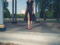 Elegant young woman in park at sunset Royalty Free Stock Photo