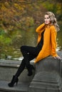 Elegant young woman posing in autumn park. Royalty Free Stock Photo