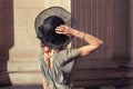 Elegant young woman standing in a grand hall Royalty Free Stock Photo