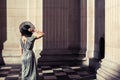 Elegant young woman standing in a grand hall Royalty Free Stock Photo