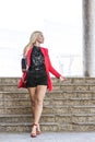 Elegant young woman walking down the stairs Royalty Free Stock Photo