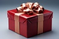 Elegantly adorned: Red gift box, golden ribbon, and exquisite bow. Royalty Free Stock Photo