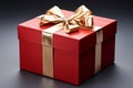 Elegantly adorned: Red gift box, golden ribbon, and exquisite bow. Royalty Free Stock Photo