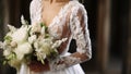 Elegantly attired bride embraces bouquet, her dress and details reflecting timeless love