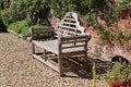An elegantly designed park bench in public garden in Dunster in Somerset, England