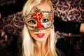 Elegantly dressed light hair model wearing a mask Royalty Free Stock Photo