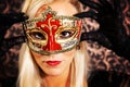 Elegantly dressed light hair model wearing a mask Royalty Free Stock Photo