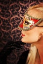 Elegantly dressed light hair model wearing a mask Royalty Free Stock Photo