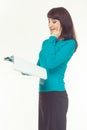 Elegantly dressed thoughtful business woman holding documents. White background Royalty Free Stock Photo