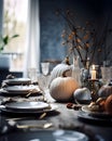 Elegantly set table with candles and white pumpkins. Pumpkin as a dish of thanksgiving for the harvest Royalty Free Stock Photo