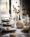 Elegantly set table with candles and white pumpkins. Pumpkin as a dish of thanksgiving for the harvest Royalty Free Stock Photo