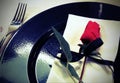 elegantly table with a rose on the black plate Royalty Free Stock Photo