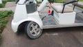 Elelctrical goft cart , wheel damaged parking Royalty Free Stock Photo