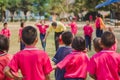 Elemantary students grade 3 take exams high jump.