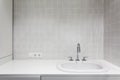 Element of bathroom interior. New wash basin, white sink and tile Royalty Free Stock Photo