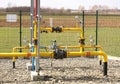 Element gas line high and medium pressure. Yellow transport pipes on the surface of the fence. Regulatory supply system for
