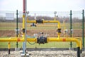 Element gas line high and medium pressure. Yellow transport pipes on the surface of the fence. Regulatory supply system for