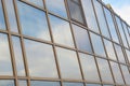 Element of the glass facade of the building. The sky reflected in the windows of an office building. Modern architecture Royalty Free Stock Photo