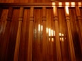 Wooden railing on the background of lacquered wall made of textured wood