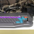 Element of an old and obsolete computer. Keyboard with joystick. Royalty Free Stock Photo