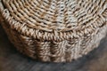 Element of a round wicker basket on a wooden background. Pattern of round texture. Top view. Copy, empty space for text Royalty Free Stock Photo
