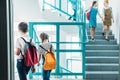 elementary age classmates walking down stairs Royalty Free Stock Photo