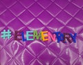 #elementary elementary hashtag on a purple background Royalty Free Stock Photo