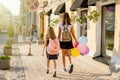 Elementary and high school students hold hands, walk down the ci Royalty Free Stock Photo