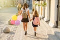 Elementary and high school students hold hands Royalty Free Stock Photo