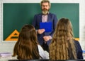 Elementary Pupil With Teacher In Classroom. Discussion group of children and teacher. Teacher and Child Learning at