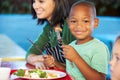 Elementary Pupils Enjoying Healthy Lunch In Cafeteria Royalty Free Stock Photo