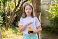 Elementary school age girl about to press a big red industrial emergency stop button, alarm, stopping action, urgency attention