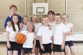 Elementary School Basketball Team With Coach Royalty Free Stock Photo