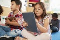 Elementary school class using tablet computers, close up Royalty Free Stock Photo