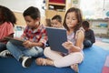 Elementary school class using tablet computers, close up Royalty Free Stock Photo