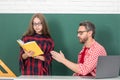 Elementary school classroom. Teacher and schoolchild pupil in class. Teacher helping young students doing homework Royalty Free Stock Photo
