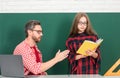 Elementary school classroom. Teacher and schoolchild pupil in class. Teacher helping young students doing homework Royalty Free Stock Photo