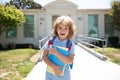 Elementary school and education. Kid holding books from primary school. Portrait of Pupil near school. Royalty Free Stock Photo