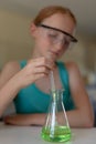 Elementary school girl in chemistry class Royalty Free Stock Photo