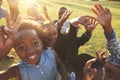 Elementary school kids outdoors, high angle, lens flare Royalty Free Stock Photo