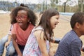 Elementary school kids playing in playground, close up Royalty Free Stock Photo