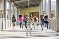 Elementary school kids running at school, back view close up Royalty Free Stock Photo