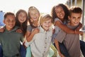 Elementary school kids smiling to camera at break time